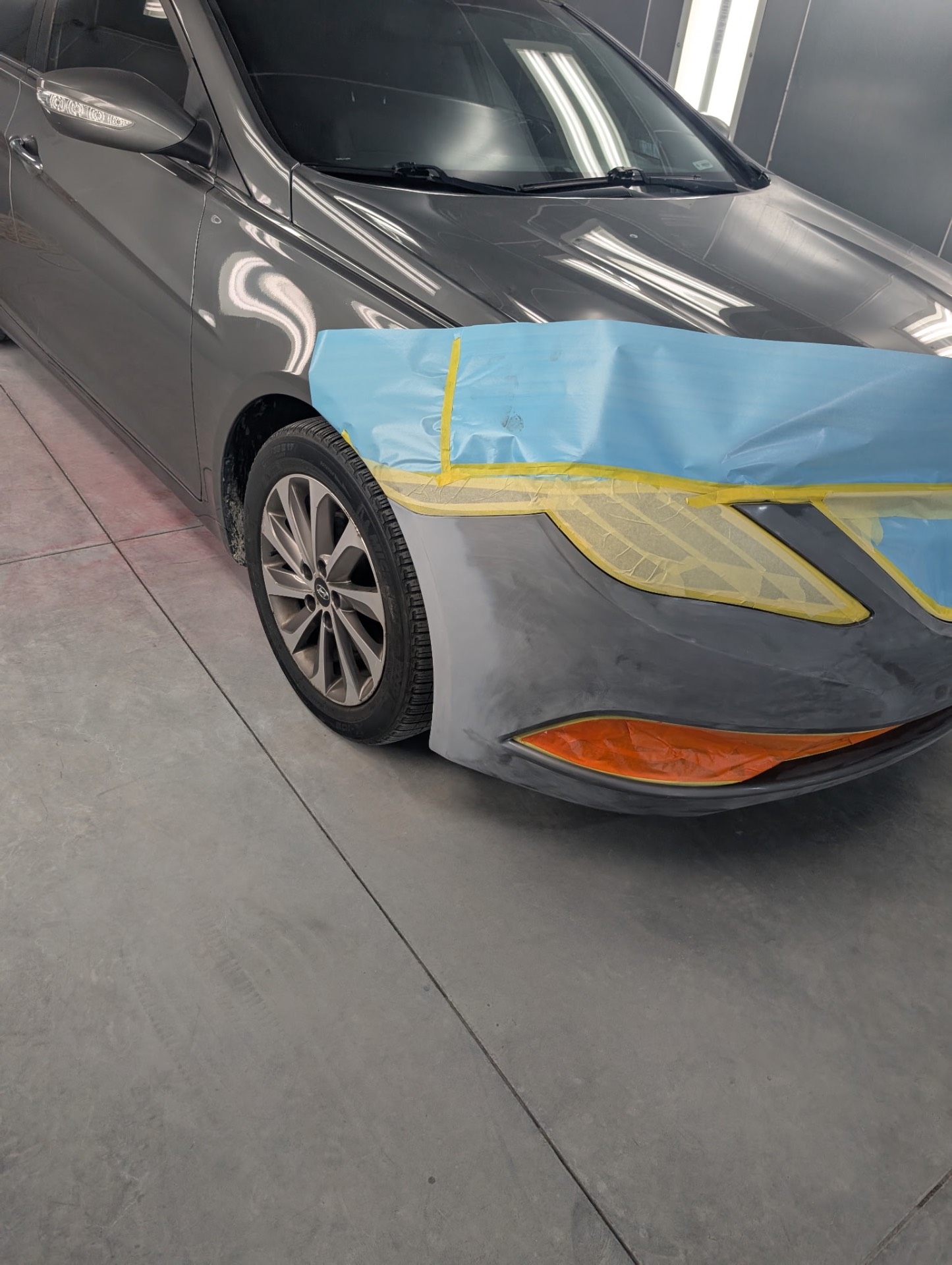 Front fender and bumper prepped for a seamless paint blend